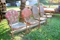 Vinrtage Red Metal Chairs Lined Up at Antique Salvage Yard