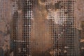 The vintag rusty grunge steel decorated by drilling a wall textured background. Royalty Free Stock Photo