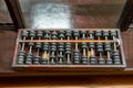 Vintage abacus for calculation on wooden background