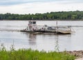 Modoc Ferry with Car crossing the Mississippi river at St Genevieve, Mo.