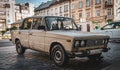 Vintage abandoned car sits on a road in Lviv, Ukraine