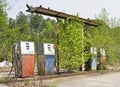 Vintage abandoned overgrown gas station