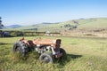 Vintage Abandoned Tractor in Sugar Cane Farm Landscape