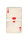 A vintage ace of hearts playing card torn in half. Royalty Free Stock Photo
