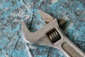 Vintage adjustable spanner on a blue background Royalty Free Stock Photo