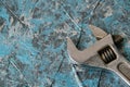 Vintage adjustable spanner on a blue background Royalty Free Stock Photo