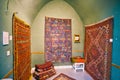 The vintage Afghan war carpet in store of Kashan Grand Bazaar, I Royalty Free Stock Photo