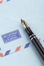 Vintage airmail envelope and fountain pen Royalty Free Stock Photo