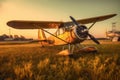 vintage airplane parked on grass airfield at sunset