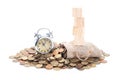 Vintage alarm clock bell, empty wooden blocks on Money bags and coins on white background.Time to invest, time value for money,