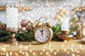 Vintage alarm clock in christmas kichen room showing five to midnight. Happy New Year Royalty Free Stock Photo