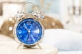 Vintage alarm clock on night table Royalty Free Stock Photo