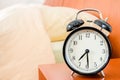 Vintage alarm Clock on a Night Table Royalty Free Stock Photo