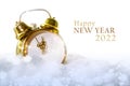 Vintage alarm clock without numbers in the snow and text Happy New Year 2022, white background with copy space