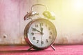 Vintage alarm clock on a red white background, toning Royalty Free Stock Photo