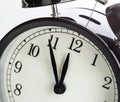 Vintage alarm clock is showing midday or midnight. It is twelve o`clock, holiday happy new year festive or lunch concept