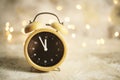 Vintage alarm clock showing midnight. christmas and bokeh, Royalty Free Stock Photo