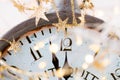 Vintage alarm clock is showing midnight. It is twelve o`clock, christmas and bokeh, holiday happy new year festive concept on Royalty Free Stock Photo