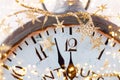 Vintage alarm clock is showing midnight. It is twelve o`clock, christmas and bokeh, holiday happy new year festive concept on Royalty Free Stock Photo