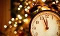 Vintage alarm clock is showing midnight. It is twelve o`clock, christmas and bokeh, holiday happy new year festive concept Royalty Free Stock Photo