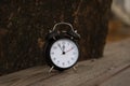 Retro alarm clock with five minutes to twelve o `clock Royalty Free Stock Photo