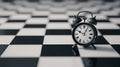 Vintage alarm clock stands on a black and white checkered floor, symbolizing concepts of time and decision-making in a classic