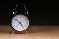 Vintage alarm clock on a wooden surface Royalty Free Stock Photo