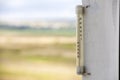 Alcohol glass thermometer Celsius outside on bright blurred light outdoors copy space background