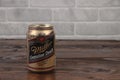 A vintage aluminium can of Miller beer against the brick wall