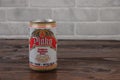 A vintage aluminium can of Plako beer against the brick wall