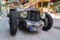 Vintage Alvis oldsmobile veteran car standing on street