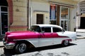 Vintage American car with Cuban flag in Havana