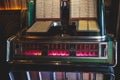 Vintage American music jukebox with illuminated buttons, process of choosing song composition, retro old-fashioned juke-box with