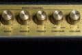 Vintage amplifier five knobs horizontal closeup, music recording studio equipment, bottom copy space Royalty Free Stock Photo