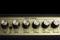 Vintage amplifier six knobs horizontal closeup, isolated, copy space on top Royalty Free Stock Photo