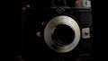 Vintage Analog Agfa Clack Photo Film Camera, Close Up Spinning. Black Background
