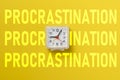 vintage analog clock with the paper not with word procrastination on top of it Royalty Free Stock Photo