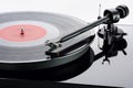 Tonearm with cartridge of turntable with record. Royalty Free Stock Photo