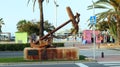 Vintage anchor from an ancient ship on a pedestal on the embankment of seaside resort town DÃÂ©nia, Spain. Sights of Denia