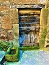 Vintage ancient door, time and history, wood, stones and moss
