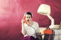 Vintage angry housewife chats on the phone in Hair salon Royalty Free Stock Photo