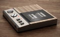 Vintage answering machine standing on wooden table. 3D illustration