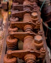 Vintage antique automotive cylinder head rocker shaft and arms covered in rust