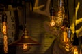 Vintage or antique light bulbs hanging on ceiling. Royalty Free Stock Photo