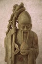 Vintage antique soapstone monk statuette carving detail grunge pattern surface abstract texture background