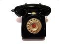 A vintage and antique telephone with white background.