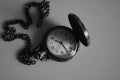 Vintage antique watch on a chain black-and-white photo