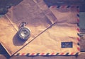 Vintage antique watches and airmail letter on wood table Royalty Free Stock Photo