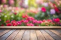 Empty wooden vintage table board on spring flower garden bokeh background. Royalty Free Stock Photo
