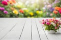 Empty wooden vintage table board on spring flower garden bokeh background. Royalty Free Stock Photo